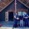 Constable Mitch Maine, Constable Evan McLean giving koha to kaumatua Dennis Rangi