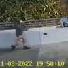 Man walking on Sandhurst Drive overbridge 