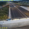 Man walking on Sandhurst Drive overbridge 