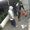 Three people damaging store