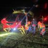 Search and Rescue personnel exiting heli