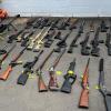 Thirty-five firearms were located during the search warrants 