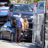 Police speak with a person at the yard in Christchurch.