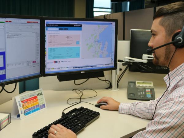 Communicator Andrew Wilson at work at Central Comms, with PCL running on his right-hand screen.