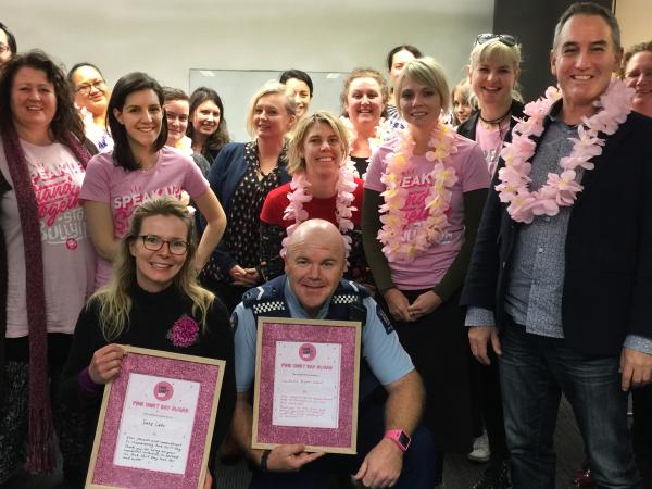 Senior Constable Bryan Ward, and entertainer Suzy Cato, receive their Pink Shirt awards.
