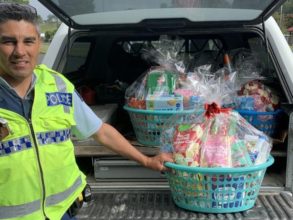 Constable Geoff Pardoe heads off to deliver Blue Santa hampers in Gisborne