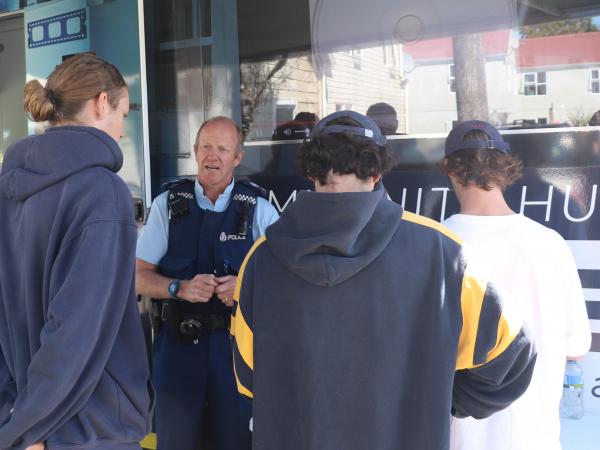 Prevention Area Manager Senior Sergeant Craig Dinnissen spreading safety messages for students moving in to the area