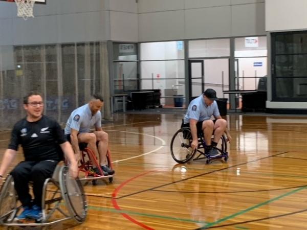 Ryan Standring, Sergeant Adrian Cheyne, and Constable Tim Coudret in action on the court