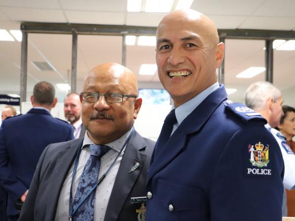 Senior Sergeant Tony Ngau Chun and Police Chaplain Enroy Talamahina.