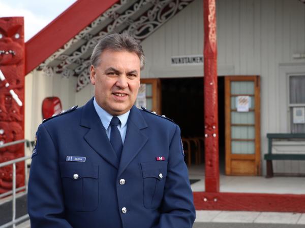 Inspector Rob Rutene standing in front of the marae.