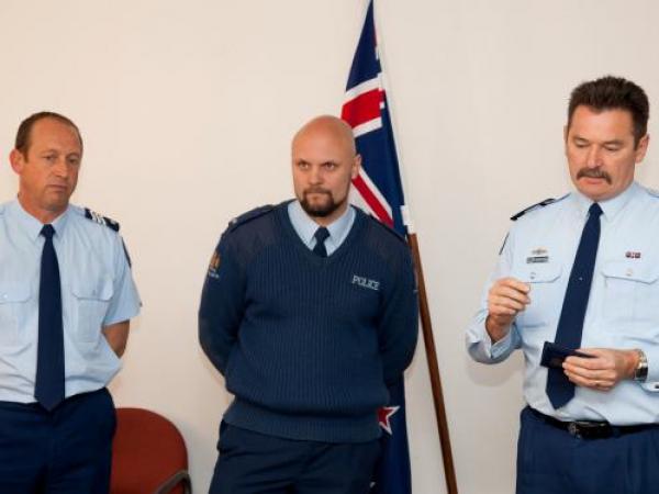Awarding: District Commander Superintendent Win van der Velde explains the actions of Sgt Neil Mouncher and Constable Ben Turner at Taupiri
