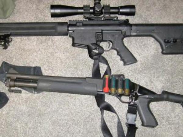 An AR15 style assault rifle and a shotgun found at the property