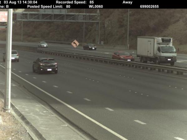 The new camera can detect vehicles speeding in any lane in either direction. The black car at left is the speeding vehicle. 