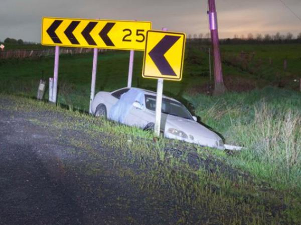 The offender's car where it failed to negotiate a bend while fleeing Police