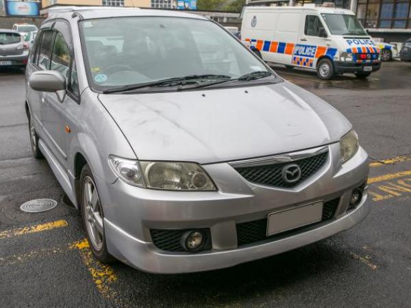 Silver Mazda Premacy station wagon, registration EWR953