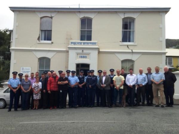 Current and former staff gather in front of the old Lyttelton police station, due to be deconstructed soon.