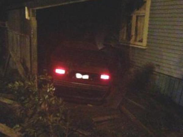 The offending car sits on top of the written off parked vehicle
