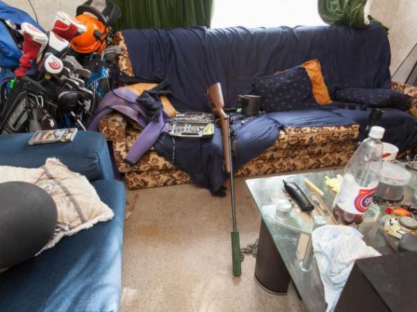 This firearm was among items recovered during the search of a Hamilton home