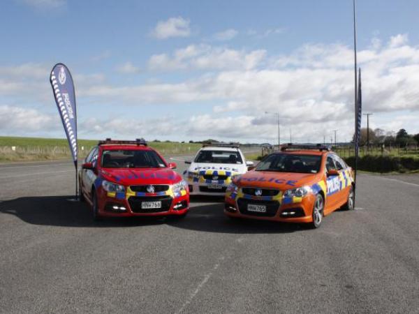 The new cars alongside a regular white patrol vehicle
