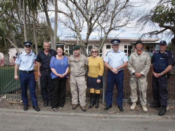 Police, Fire, and Army staff with Gonville head teacher Katie Fry (left) and Whanganui Mayor Annette Main (middle)