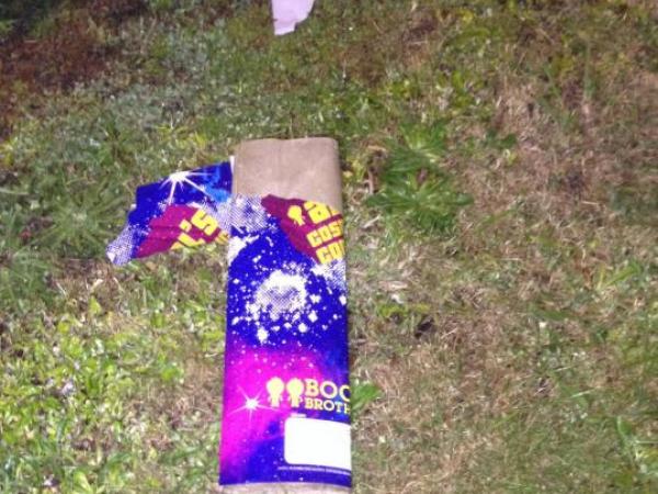A group of youths allegedly lit this firework next to an elderly woman's home, causing a roof fire