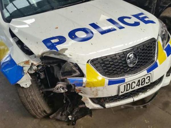 The crash of a patrol car linked to the overnight incident is now under investigation