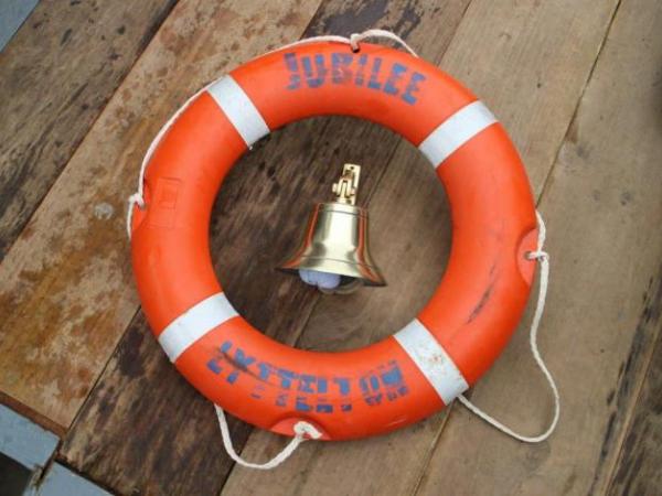 Ship's bell and lifebuoy recovered from the FV Jubilee by the Royal New Zealand Navy's Operational Diving Team