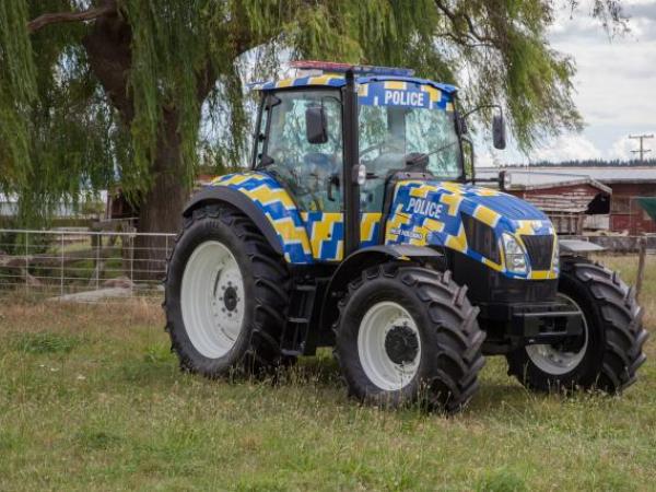 The police branded tractor is on it's way to the Gore Santa Parade.