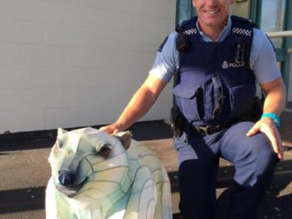 Constable Philip Currie with the young fella, about to make his way home