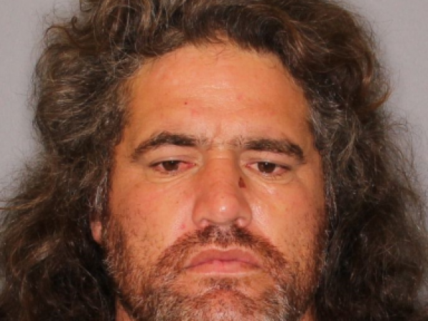 Darren Millar has a warrant for his arrest on assault charges