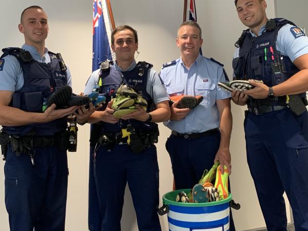 Acting Inspector Mark Clayton and Auckland staff involved in the Police Boot Bin Project
