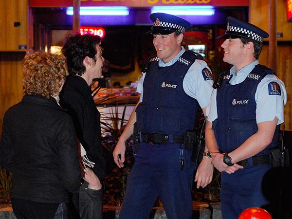 Young people chatting with police on a night out