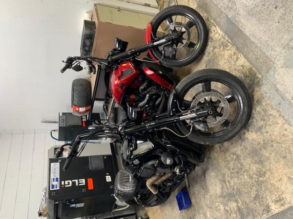 Two motorbikes in a garage 