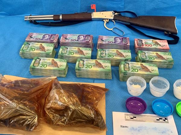 Meth, Iodine tablets, cash and a firearm were recovered from the address