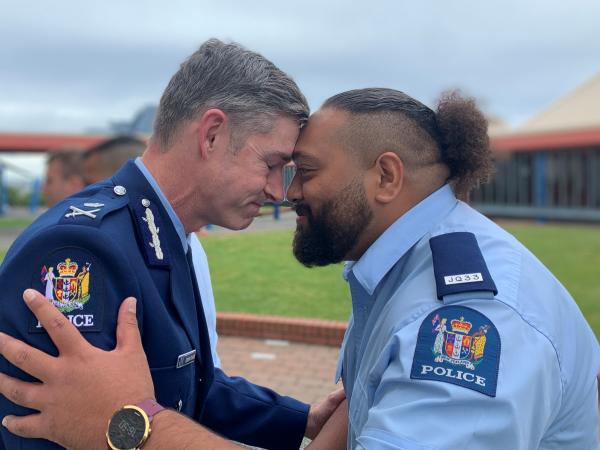 Photo of Commissioner Andrew Coster with Constable Dominic Malo