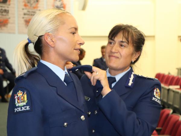 Constable Mahina Martin, who will receive the Leadership Award, receives her epaulettes from Deputy Commissioner Tania Kura.