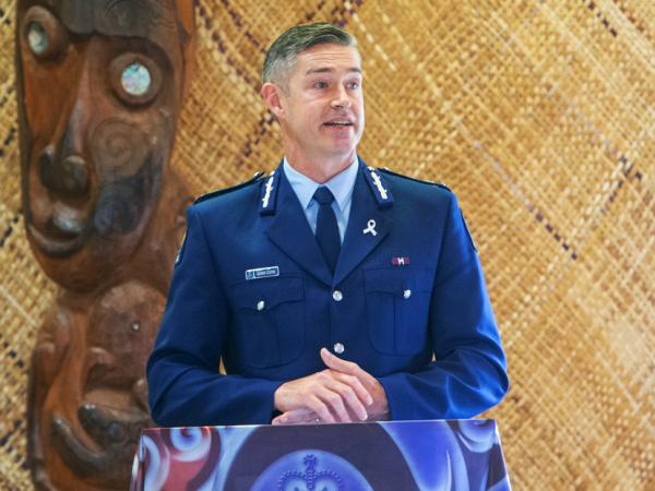 Commissioner Andrew Coster addresses the ceremony.
