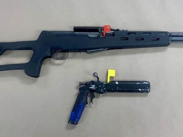 Two unlawful firearms recovered from the search warrants