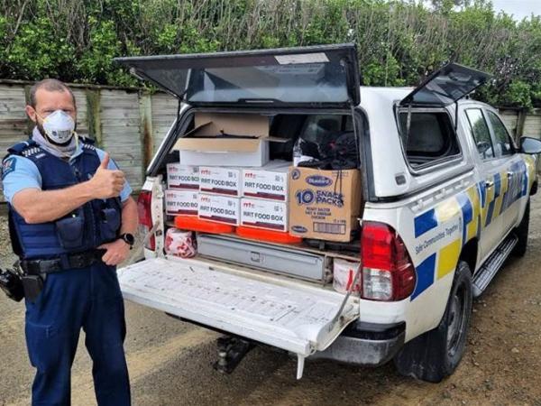 Police vehicle packed with food boxes in Maungaturoro