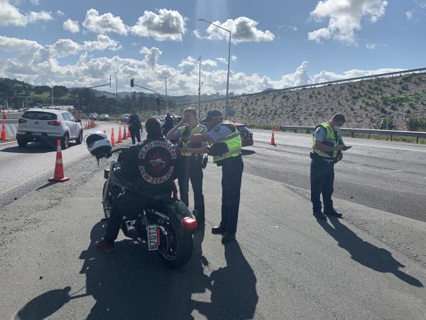 Police stopping and checking riders
