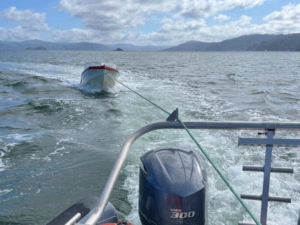 The boat being towed back to shore