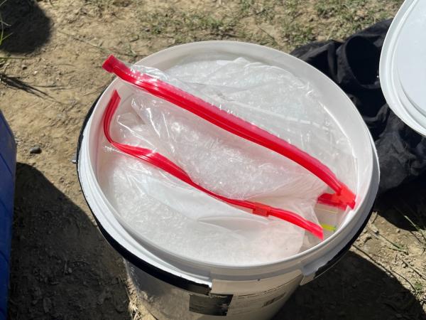 A bucket containing methamphetamine, located during a search warrant