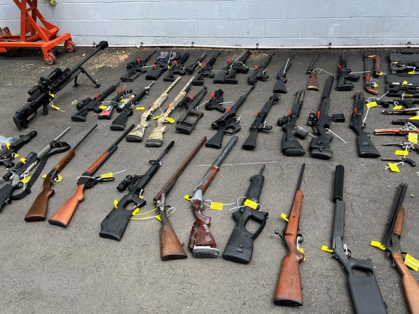 Thirty-five firearms were located during the search warrants 