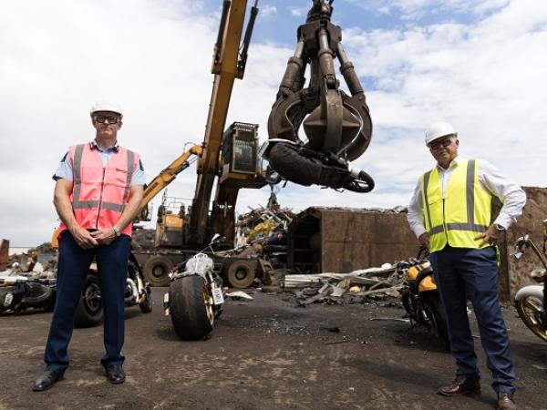 Police Commissioner Andrew Coster and Minister of Police Mark Mitchell with the six motorcycles destroyed