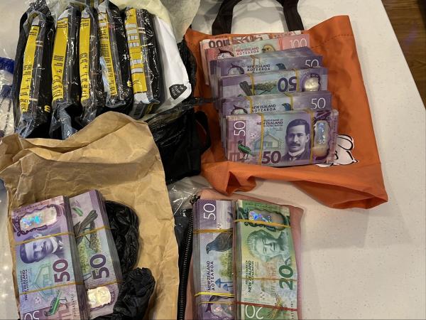 Cash seized during 17 search warrants across Auckland
