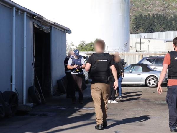 Police and Customs officers executed simultaneous warrants in Wellington and Christchurch yesterday.