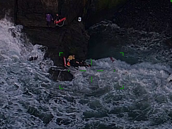 Police and Muriwai Volunteer Lifeguard Service rescued two people trapped on rocks yesterday evening.