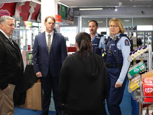 Police and the local mayor visited local businesses