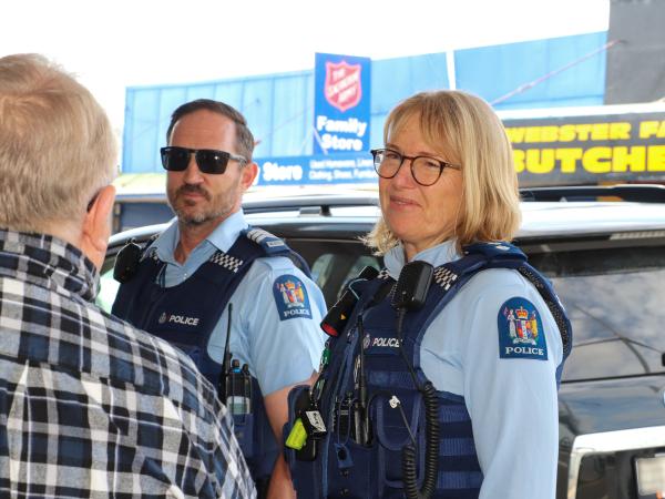 Sergeant Dalbeth and Inspector Nordstrom talk with the public in Dargaville