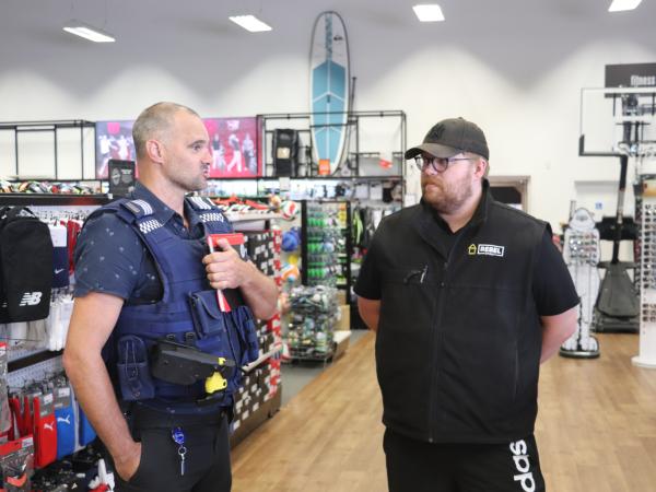 Police talking with local businesses